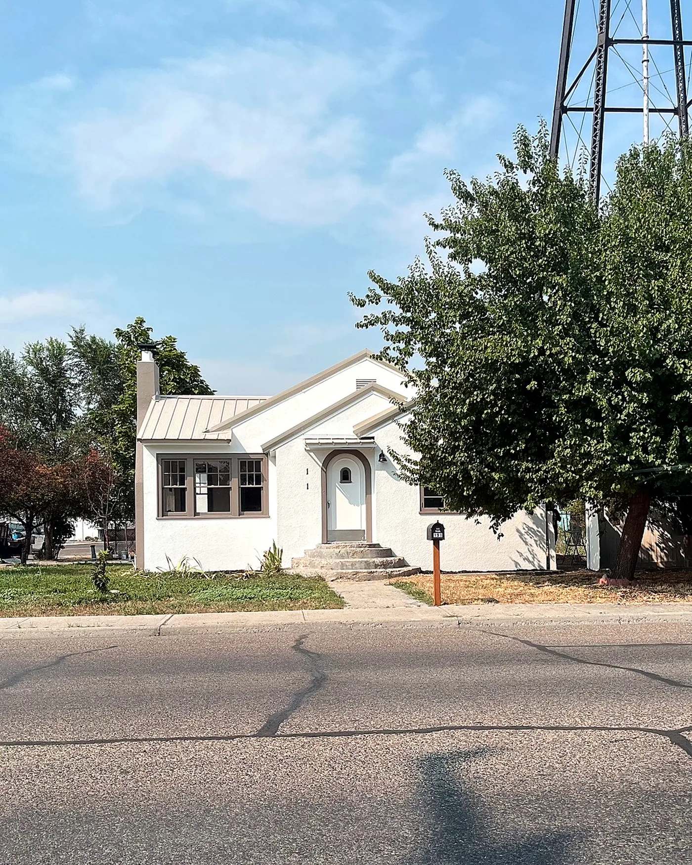 Finished single-story stucco home with a new standing seam metal roof